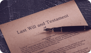 A "Last Will and Testament" document lies on a textured surface next to a classic fountain pen.